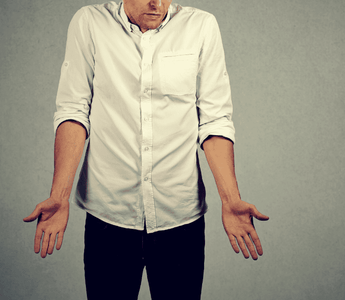 A man shrugs in frustration wondering if his saggy balls mean varicocele