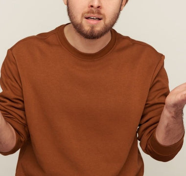 A man shrugs wondering how saggy balls can get