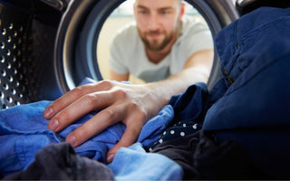 A man treats his mens pouch underwear for underwear stains