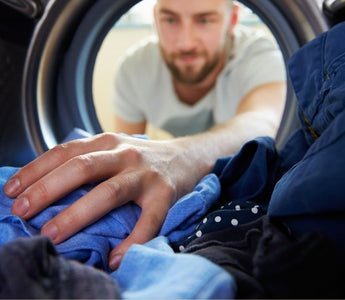 A man treats his mens pouch underwear for underwear stains