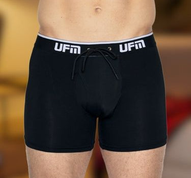 A man wears black UFM pouch underwear for testicular support